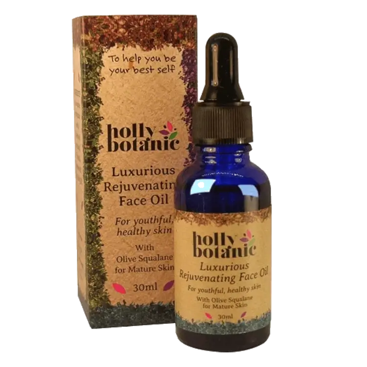Holly Botanic rejuvenating face oil box and bottle. Recyclable cardboard box. 30ml blue, recyclable glass bottle with pipette.