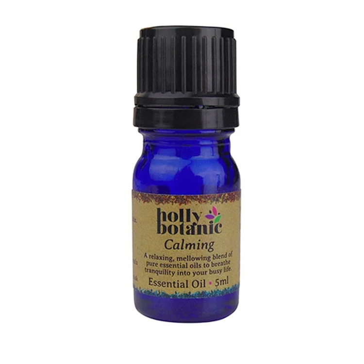 Holly Botanic calming essential oil blend product image. 5ml blue glass, recyclable dropper bottle.