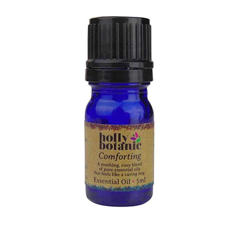 Holly Botanic comforting essential oil blend product image. 5ml blue glass, recyclable dropper bottle.