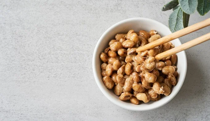 Natto, made from fermented soybeans, is the highest source of vitamin K2 available.
