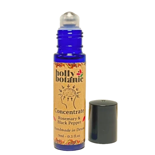 Concentration pulse point oil by Holly Botanic, lid off showing rollerball. Essential oils blended with sunflower oil to improve focus, concentration and memory.