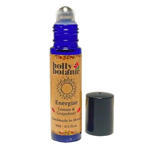 Energise pulse point oil by Holly Botanic with lid off showing rollerball. Essential oils blended with sunflower oil to invigorate and energise.