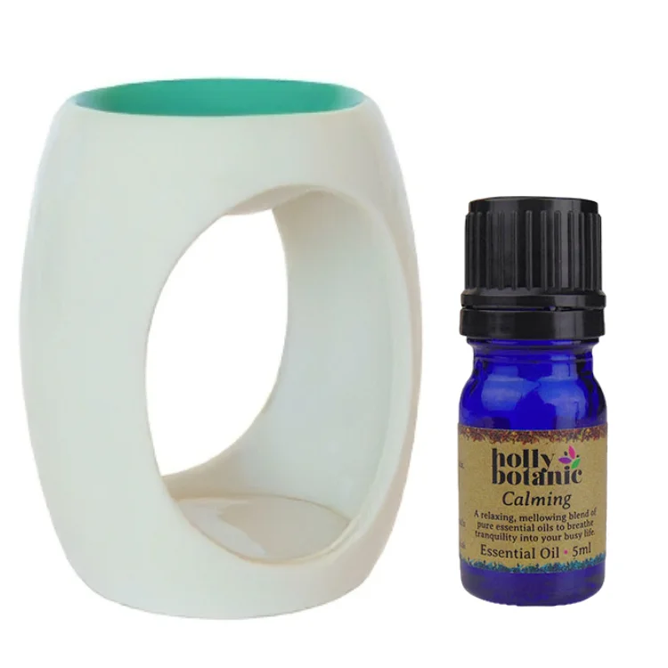 Oil burner and essential oil blend bundle. Choose an oil burner: red, purple, pink or green and a Holly Botanic essential oil blend: calming, comforting, defence, grounding or uplifting. Save 15%